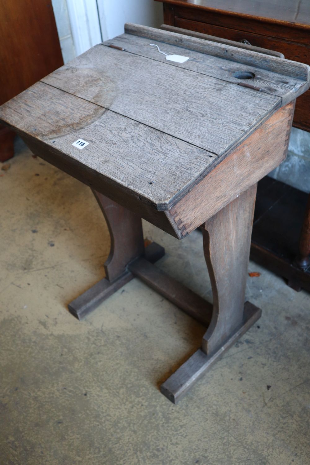 An early 20th century oak school desk, width 56cm
